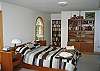 This is what will likely be considered the Master bedroom as it is larger than the other 2, yet equally outfitted with a Queen size bed.