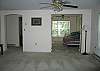 The room pictured here currently features a foos ball table, and is located just off the Living Room, between what is considered the second bedroom and a full bath which would be through the door to the left.
