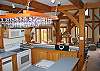 The center console style of the kitchen design ensures the cooks will enjoy inclusions from the kitchen into the Great Room.  The view out the kitchen window to Mount Washington's summit beyond is also worthy should you wish to just "turn your back" on it all.