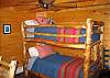 The Timber Ridge Retreat's sixth bedroom features the bunk set as seen above, yet just out of scene is a full size office desk, chair, and mini office center including a scanner-copier-printer fro your use.