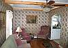 The Bear Moose Crossing is great in that there are 2 living areas, each set on either ends of the kitchen.  This one has a ceiling fan in summer & a gas fireplaced stove in winter.  Just perfect for all seasons.