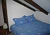 The fourth bedroom of the Furst Haus offers another full size futon style bed arrangement comfy for two.