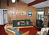 Here is another angle on the ample living space of this otherwise efficient White Mountain chalet.