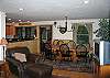 This would be looking back on the kitchen, dining and family den areas from the middle of the living room area. Enjoy tons of windows, supplying lots of natural light and a feeling for the White Mountain outdoors that is not easy to match.