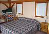 The second bedroom in the lodge features a king size bed, just like the master bed, however this room also offers folks a full size crib, daybed and optional cot enabling folks to spread out a bit.  A young 4 person family could enjoy this room rather easily.