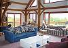 The great room here is so large that it really does require 4 full size photos to show it all adequately for you.  Windows, windows, windows... tons of windows, great views and of course lots of light.