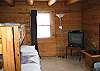 The main floor bedroom also offers a second TV watching area, or gaming playstation for that matter.