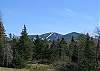 The winter snows of Cannon Mountain ski area are still to be seen well into spring. Franconia Notch State Park looks far-away yet will be only 4 miles from your door.