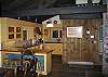 Here is an alternative view looking into the kitchen from the dining-living area of the #3 Woodchuck Chalet, a Grand Class, professionally managed Fraconia Notch Vacations Vacation Rental Home.
