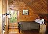 The master bedroom is actually up in the well enclosed loft which features a Queen bed plus 1/2 bath for easy evening relaxtion.