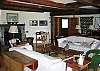 A beautiful fireplace and cozy couches make this lving room a fantastic place to sit by the fire and entertain your friends and family.   Ah... relax.
