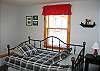 The 3rd and final bedroom was completely redone just this spring- 2008.  A new daybed with trundle hidden beneath replaces an older set of bunk beds and is both a much better use of space- and much more user friendly.