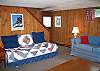 The lowest level of the Ridgecut Family Chalet features an family friendly den area allowing for some seperation as may called for.