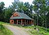 Perched atop the drive-way is you will find "Izzy's Pearl Lake Log Home, a perfect woodman's cabin completely outfit to include quality gas BBQ Grill and a small chiminia for evening enjoyment.