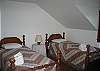 The fourth bedroom on the second floor features 2 good quality twin size beds nicely adorned with traditional styyle quilts for extra comfort on cooler nights.