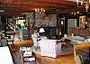 Lots and lots of room is what to expect out of Butternut Lodge.  This is a great shot of the sitting and kitchen areas as you look past toward theformal living area.