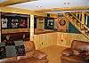 You will find lots of comfy seating for your TV and movie viewing pleasure on the 46" Flat Panel Hi-Def TV with Blu-Ray DVD included.  Plus there's even a few movies waiting for you in the entertainment center and don't forget all the games one can expect, including darts, pool and more.