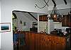 Looking into the fully equipped kitchen and dining area, with the living area and great views of the Cannon Tram at our back.