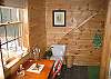 The Master Suite enjoys it's own sizeable and private bath.  Where it's as cute as it is,  we prefer to call it a Powder Room.  Lots of inspiration for the days White Mountain activities that lie ahead come flowing through that window we can assure you.