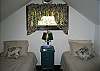 The 3rd bedroom within the Goodwin's Sunset Chalet is located on the top floor and has a vaulted ceiling to it. Close the door and leave the outside world behind. The White Mountains will be waiting for you come waking time however.