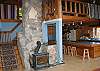 The grand hand made hearth and wonderful Heartstone SoapStone Woodstove will warm not just the toes but also your heart as it brings this White Mountain Log Home to life.