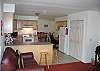 The kitchen is centrally located betwen the dinig room on one side and the living area with access to the deck on the otherside.  The cook will enjoy easy access to both areas.