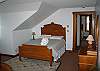 The opposing view of the thrid bedroom, featuring 2 queen size beds.