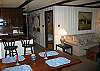 Walk thru door and you are immediately into the living, dining area which enjoys a sliding glass door with wonderful views to the great beyond.