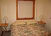 This bedroom offers guests a full size sleeping experience and 2 large windows to enable early morning views if folks so choose.  The White Mountain vacation experience will be waiting just outside those windows when ever you decide to rise-n-shine.