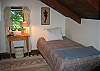 The third bedroom is on top floor and offers another set of twin size beds... and a view down to living area when the door is left open.