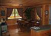 The dining area is warm and well situated right immediate to the kitchen.  The open concept will keep the cook in touch with the crowd without the crowd being in the way of cook.   Designed to compliment the cook, not have folks get in thier way.