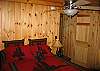Located on the main floor of the Timber Ridge Retreat, the fifth and six bedrooms sort of style themselves as a family suite in that there is one bedroom to the right with a single set of Bunks, a full bath in the middle, and then the other bedroom to the left which offers a Queen bed set, as seen above.