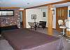 The lowest level of the Round Mounatin Lodge, located in Bethlehem, NH's White Mountains region, features a rather large Family Game Room with regulation pool table, dart board and card table.  The Wet Bar with mini fridge helps here too.