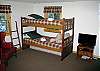 The lowest floor of Camp Narnia is fully furnished for up to 4 guests.  One bunk set, plus one King bed.