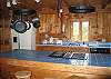 Sitting at the breakfast bar or standing at the sink to finish off the dishes, guests will be enjoying views off to north western foot-hills  of NH's White Mountains.