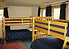 The fourth bedroom of Kinsman Valley View is very kid friendly, however it's been built sturdy enough to support most any adult in comfort.  There are 3 sets of bunk beds in this room offering sleeping for up to 6 comfortably.