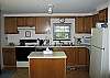 Well equipped with all the pots, pans and dishes necessary to cook and serve a great family meal.  The dining room table in the next room over is waiting to recieve the efforts of your work in this room here.