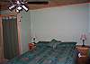 Actaully this is the only bedroom in the Tuck-Away Cabin.  It's a one bedromm home plus loft sized home after all...  Comfort is the design in all seasons.  The radiant heat, ceiling fan and A/C assure 4 season comfort for all who visit this White Mountain Hideaway.  A true Homeaway from home.