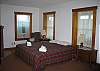 The king size bed that faces the gas-fireplace insert makes the ground floor master bedroom of The Pettyboro Place quite enjoyable.  You'll see.