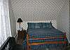 This room offers a 2 new twin size beds plus a single double or full size bed, seen here.