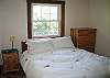 Located on the main floor just off of the living area, this "Main bedroom" is considered primarily so because it offers the most room of them all, plus a great quality Queen size bed.