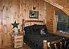 The third bedroom of Franconia's Timber Ridge Retreat offers a full size bed with a full size set of fun games and posters for the younger members of your family or group.  As a Franconia Notch Vacations professionally managed vacation home your expectation of comfort and relaxation will be realized.