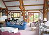 View number 2 of the Great Room within the Round Mountain Lodge, located in the heart of NH's White Mountains.  You'll be so close to Mother Nature you'll be able to hear her sleep.