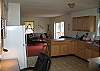 This would be looking toward the living area as you first enter the kitchen, which features a wonderful work desk should you need to do a a little business while enjoying your Homeaway from home in Franconia, NH.