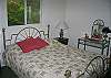 A Queen size bed, lots of closet space and a built in vanity-dressor make this the perfect set-up for getting up.