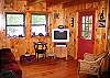 It may not be an overly large living area at "Izzy's" however there are lots of great angles and aspects, such as the door that you see here which leads out to the petty coat porch.