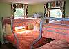 Bedroom # 6... offers to sets of pryamid style bunk beds with a full size bed on the bottom and twin size on top.
