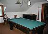 The full-size pool table is the center stage of the game room located above the kitchen, and where it is not immediate to any bedrooms it is ideal for the games of late.  Play away till the hearts content.