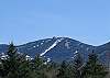 Using the same camera, standing in the same spot yet zooming in a bit, here's a clearer shot to the top of Cannon Mountain. Summer guests enjoy easy access to the top by the Cannon Mountain Arial Tramway open everyday weather permitting.
