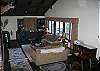 The Living Area flows nicely from the dining room, offering 2 plush couches and a grand fireplace perfect for taking the chill off of our cooler evenings.  In Grand style, the wood is provided.